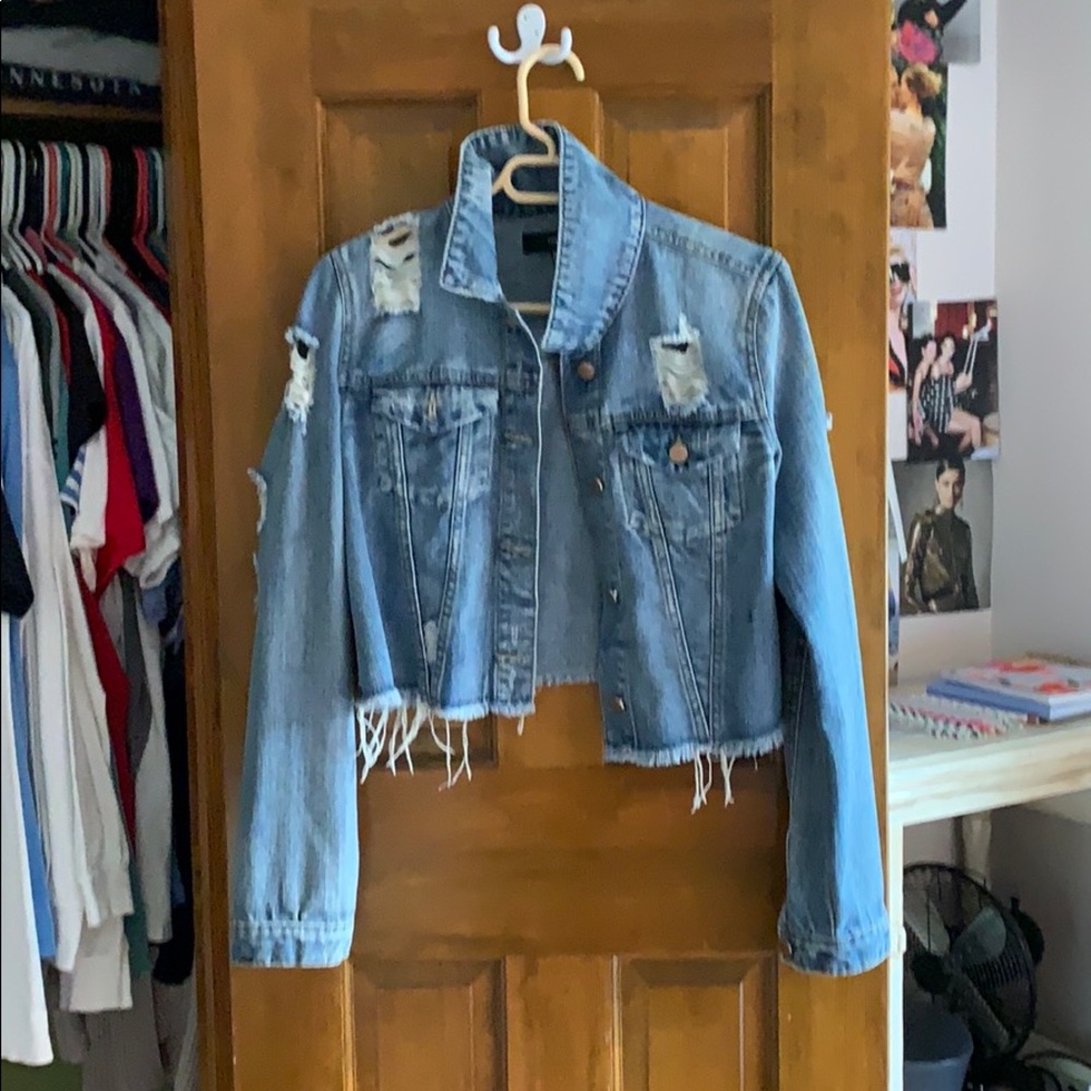 a ripped jean jacket